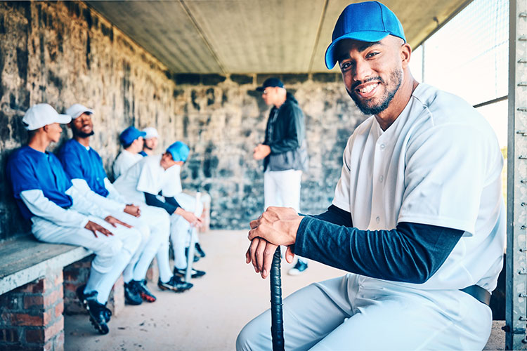 Baseball team sitting on the bench