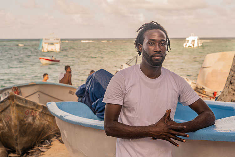 Young Fisherman by his boat